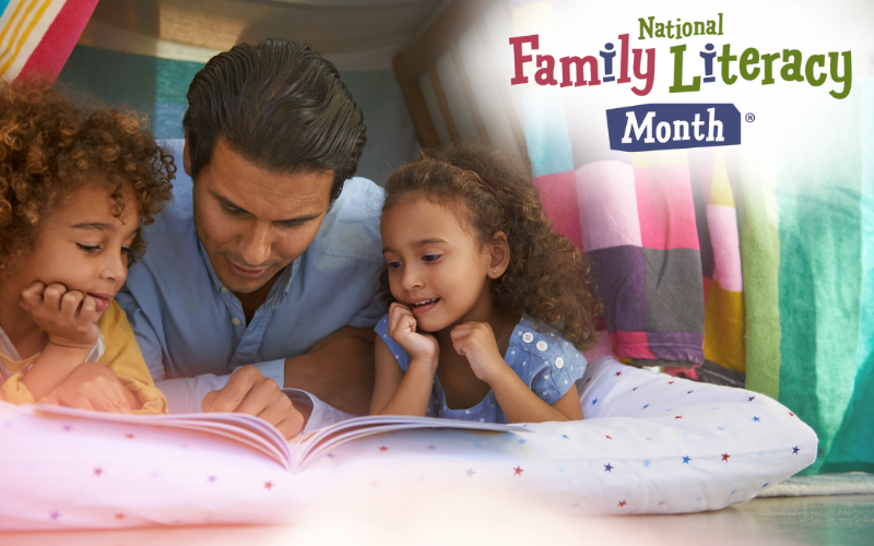 A man and two children read a book under blankets. The logo says "National Family Literacy Month".