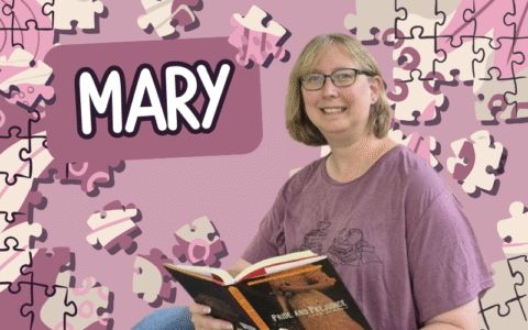 A woman wearing a purple shirt and holding open a book is in front of a purple background with puzzle pieces.