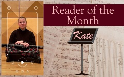 A woman sits with an instrument on her lap. Music sheets are the background.